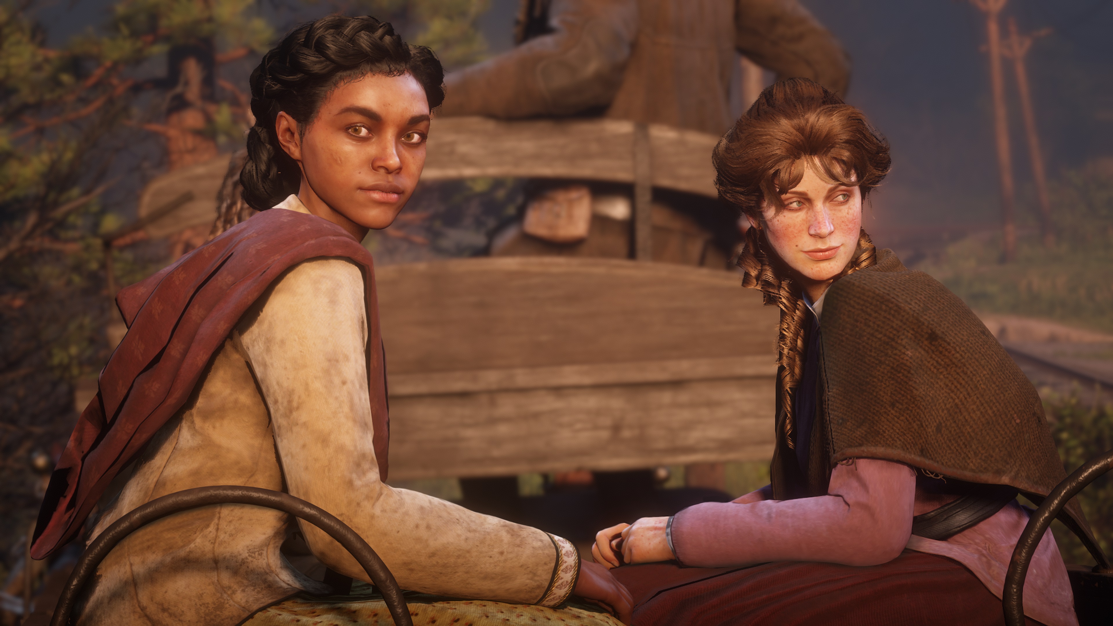 Red Dead Redemption 2 screenshot deux femmes assises dans une charrette