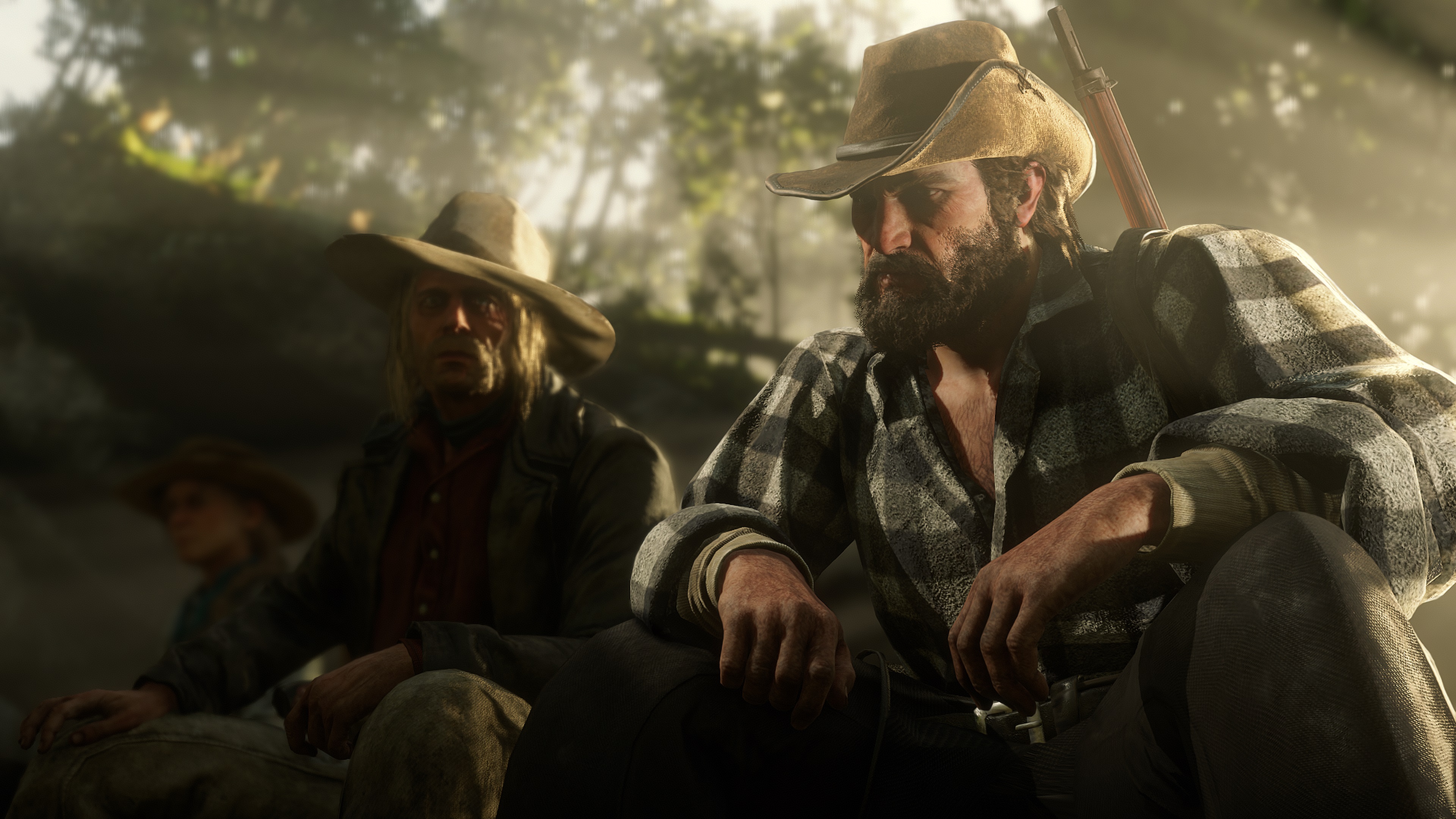 Red Dead Redemption 2 screenshot deux cow-boys assis