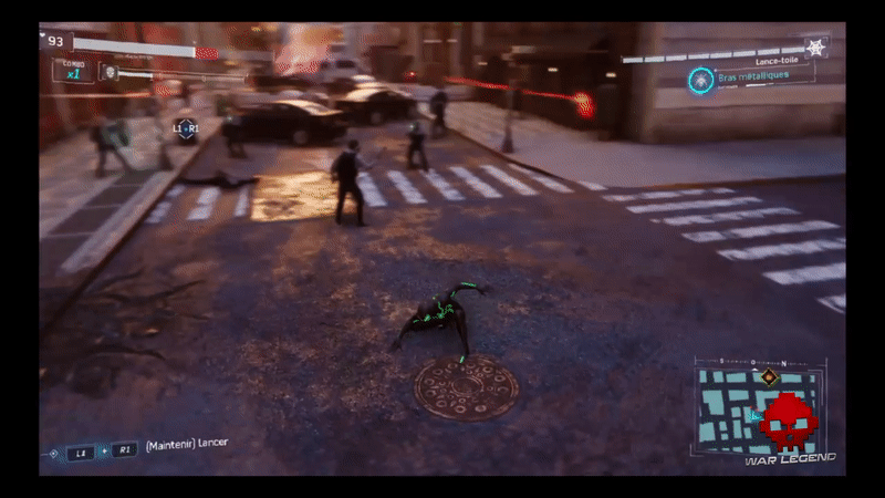 Spider-man glissade sous un ennemi